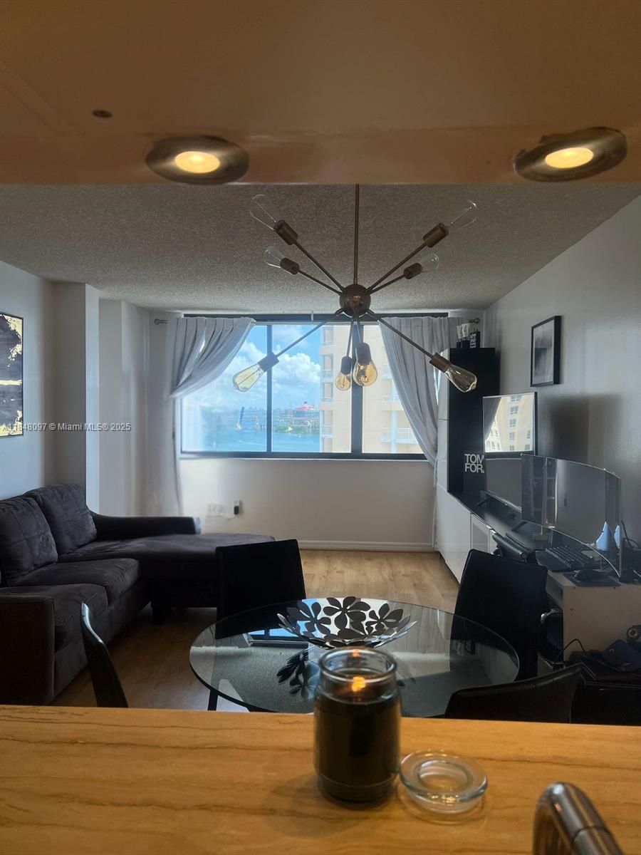 540 Brickell Key Drive, Unit 1524 Miami, FL 33131 - Photo 4 of 44 a kitchen with a sink and a stove top oven