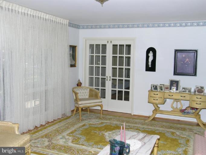 13900 Alderton Road Silver Spring, MD 20906 - Photo 10 of 11 Formal living room with French doors