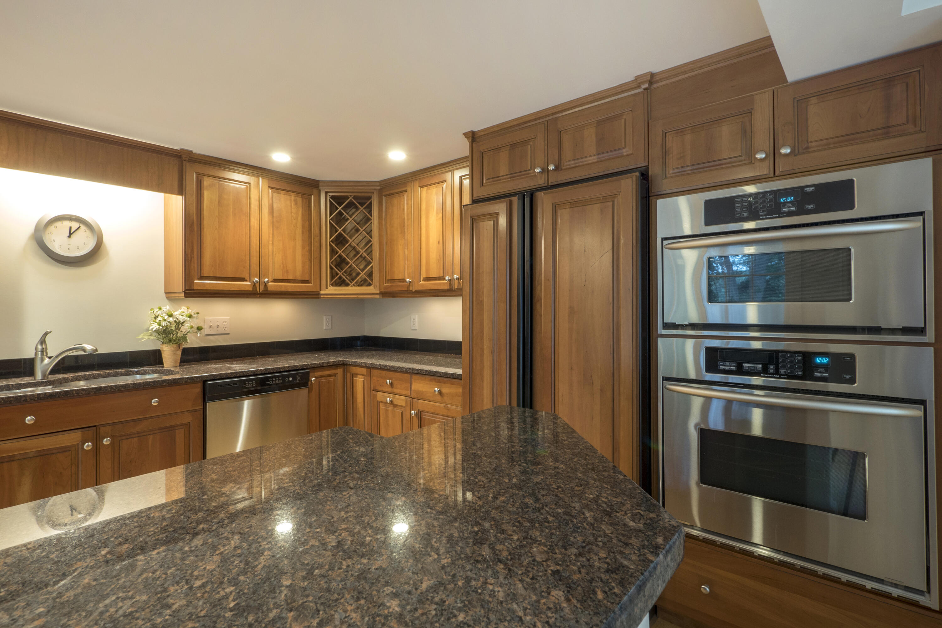 303 Maple Street West Barnstable, MA 02668 - Photo 11 of 19 a kitchen with stainless steel appliances granite countertop a stove a sink and a microwave
