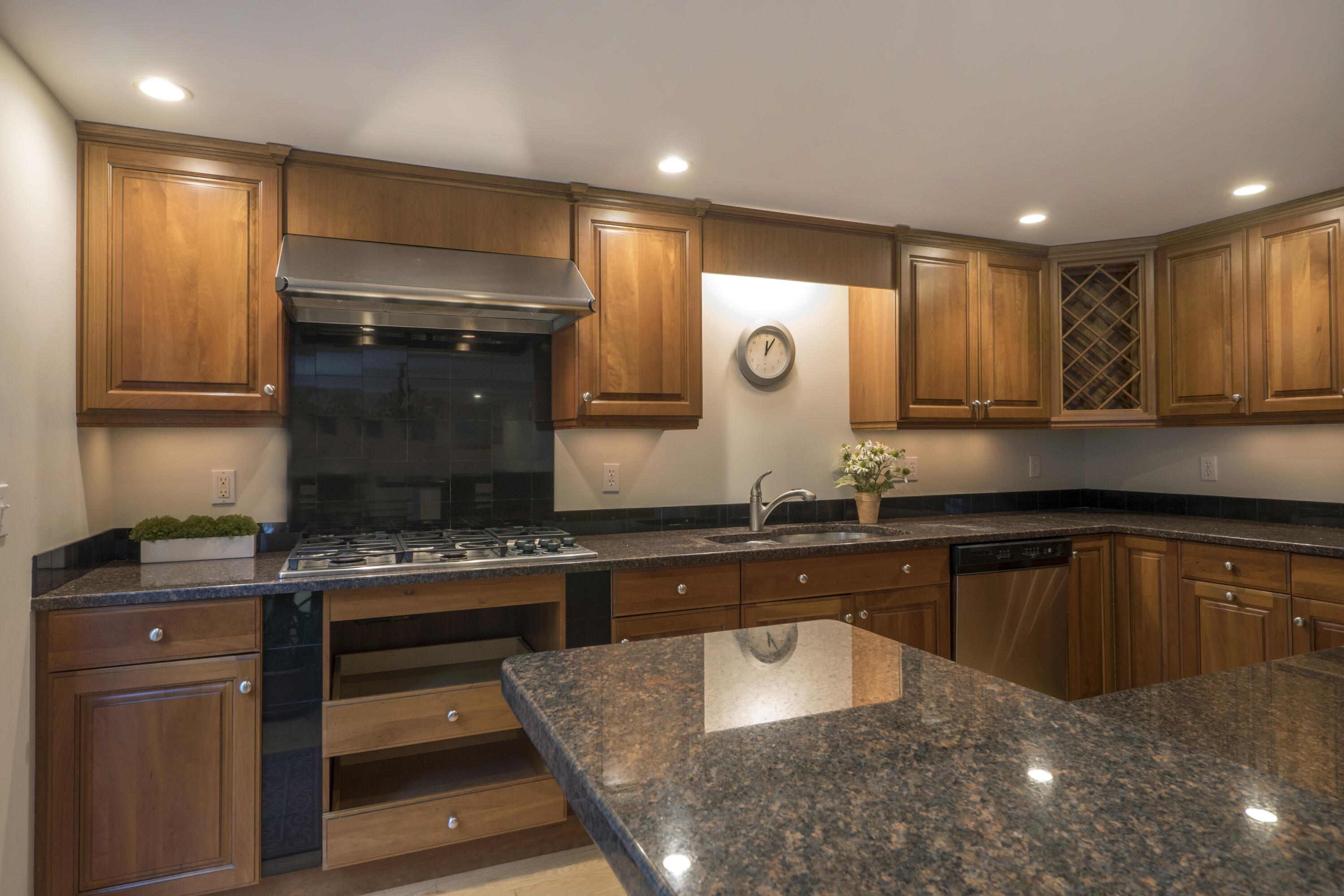 303 Maple Street West Barnstable, MA 02668 - Photo 12 of 19 a kitchen with a stove a sink and a microwave
