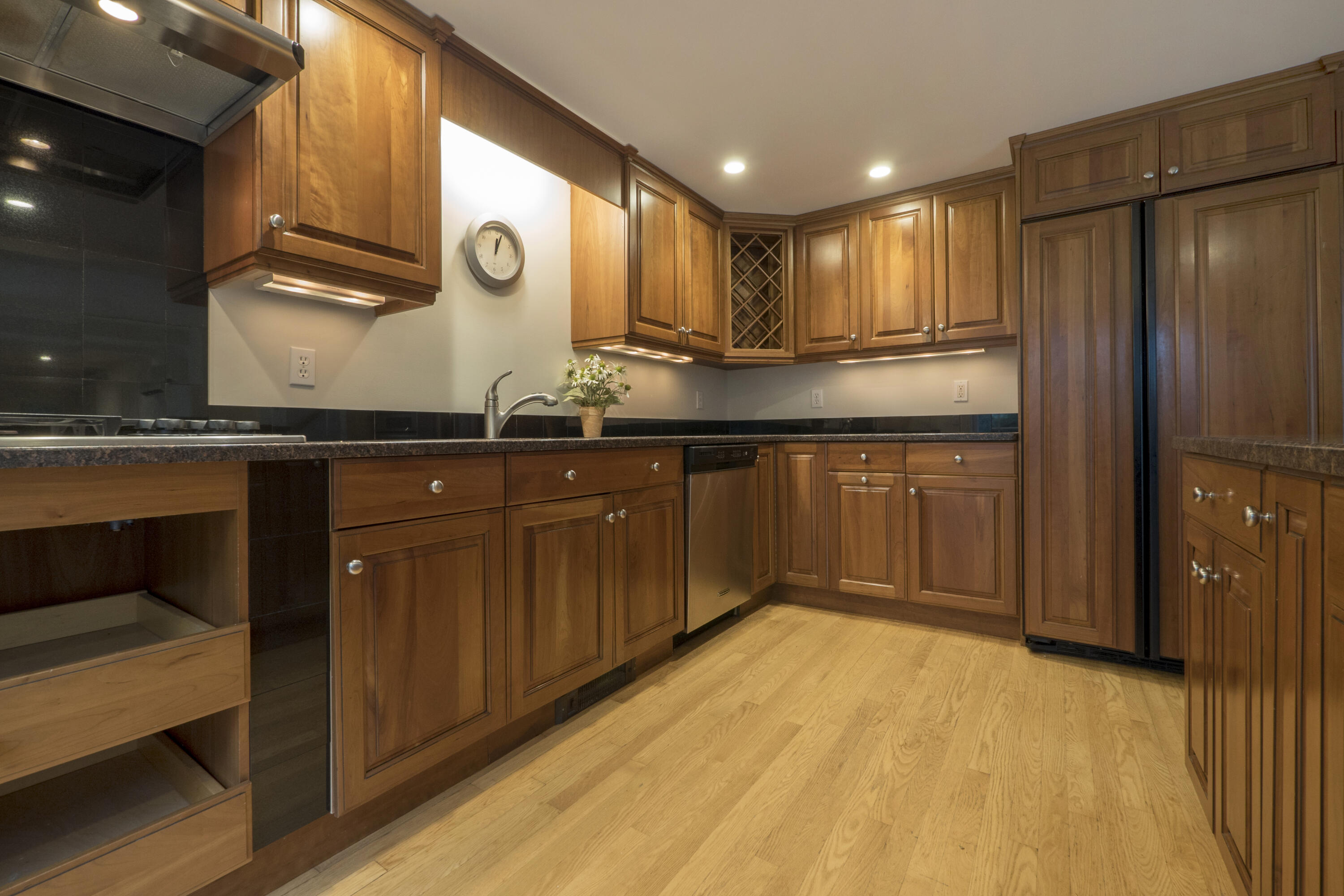 303 Maple Street West Barnstable, MA 02668 - Photo 13 of 19 a kitchen with stainless steel appliances granite countertop a sink and wooden cabinets