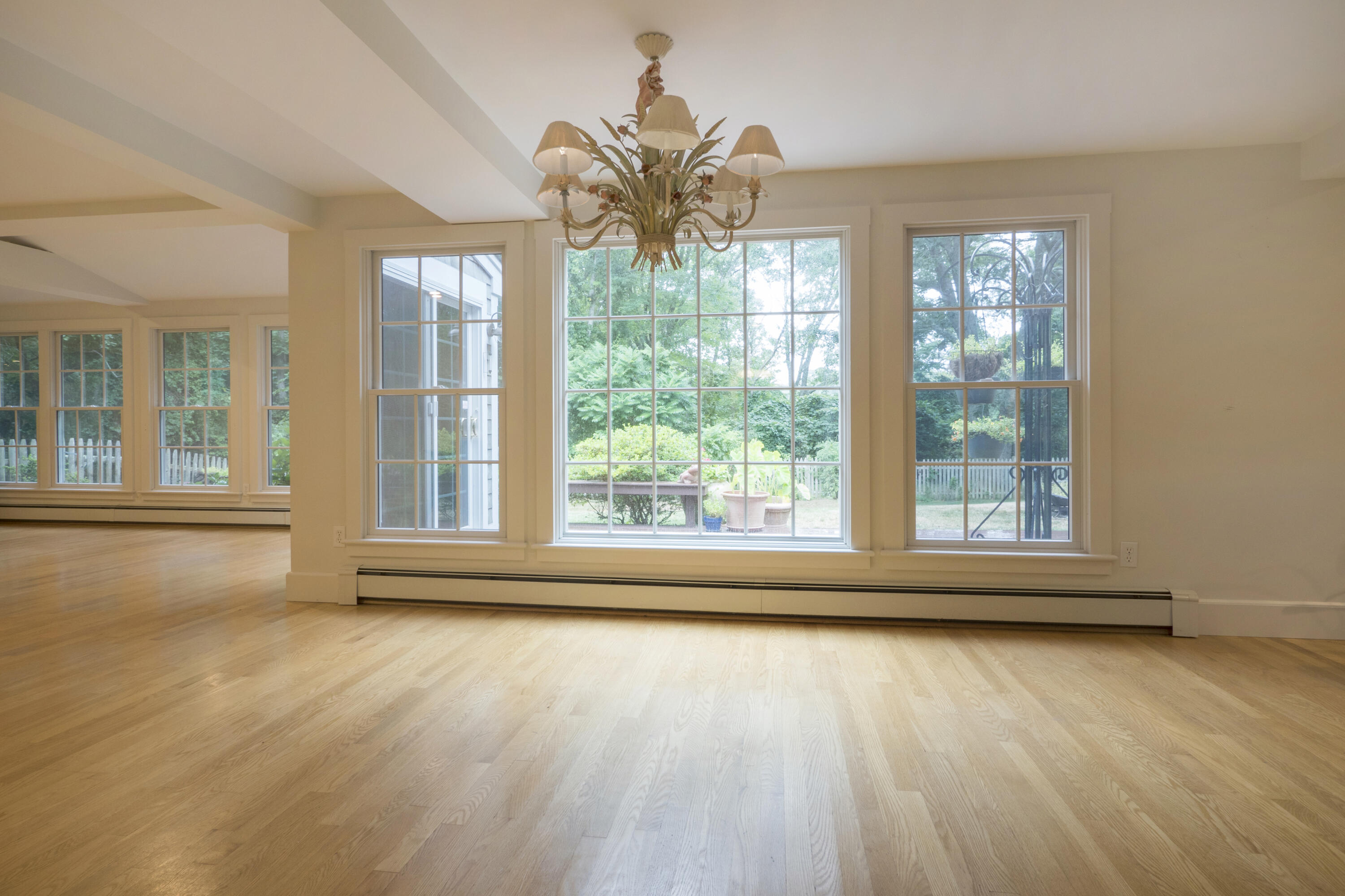 303 Maple Street West Barnstable, MA 02668 - Photo 14 of 19 a view of empty room with wooden floor and fan