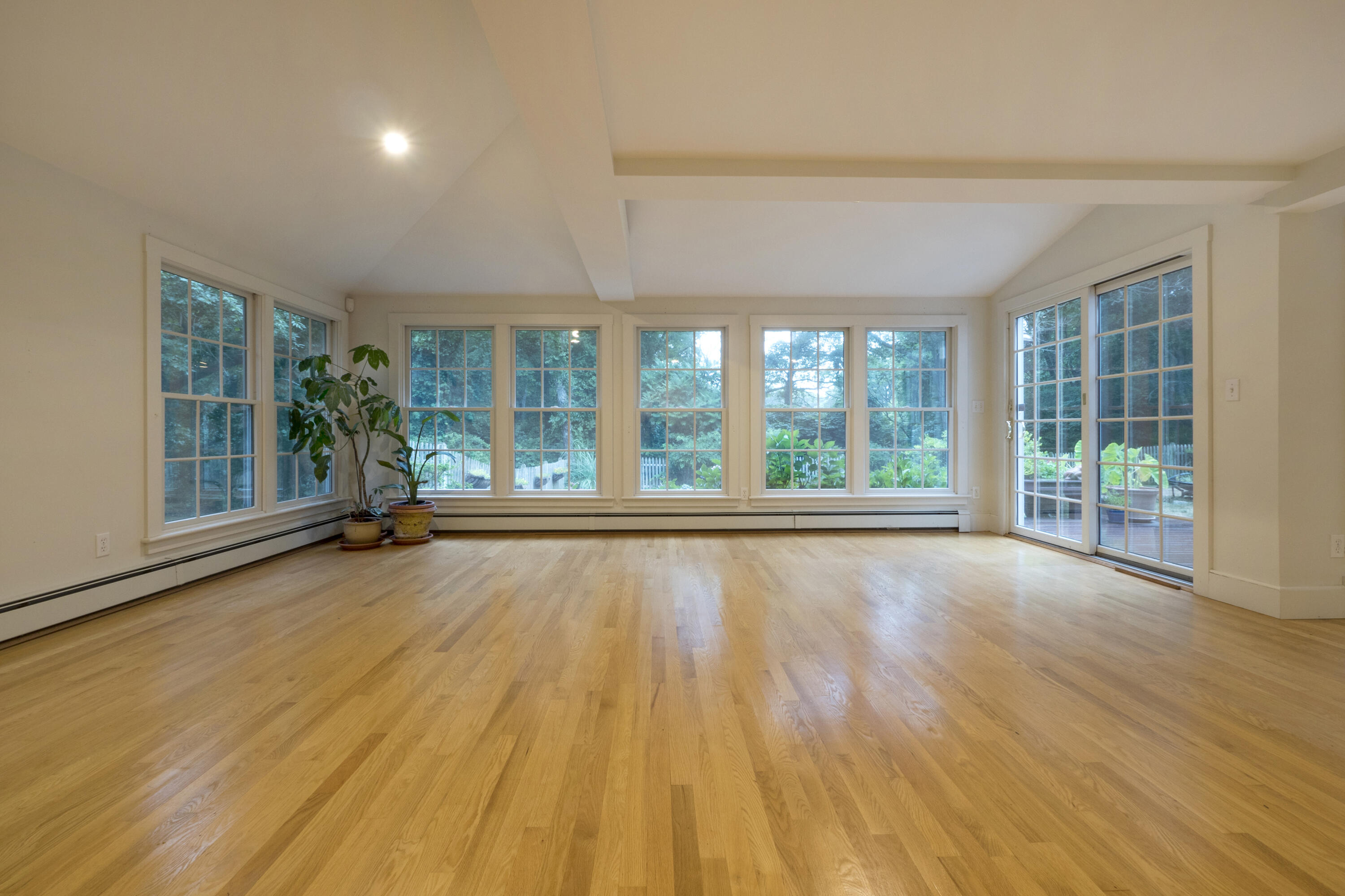 303 Maple Street West Barnstable, MA 02668 - Photo 17 of 19 a view of an empty room with wooden floor and a window