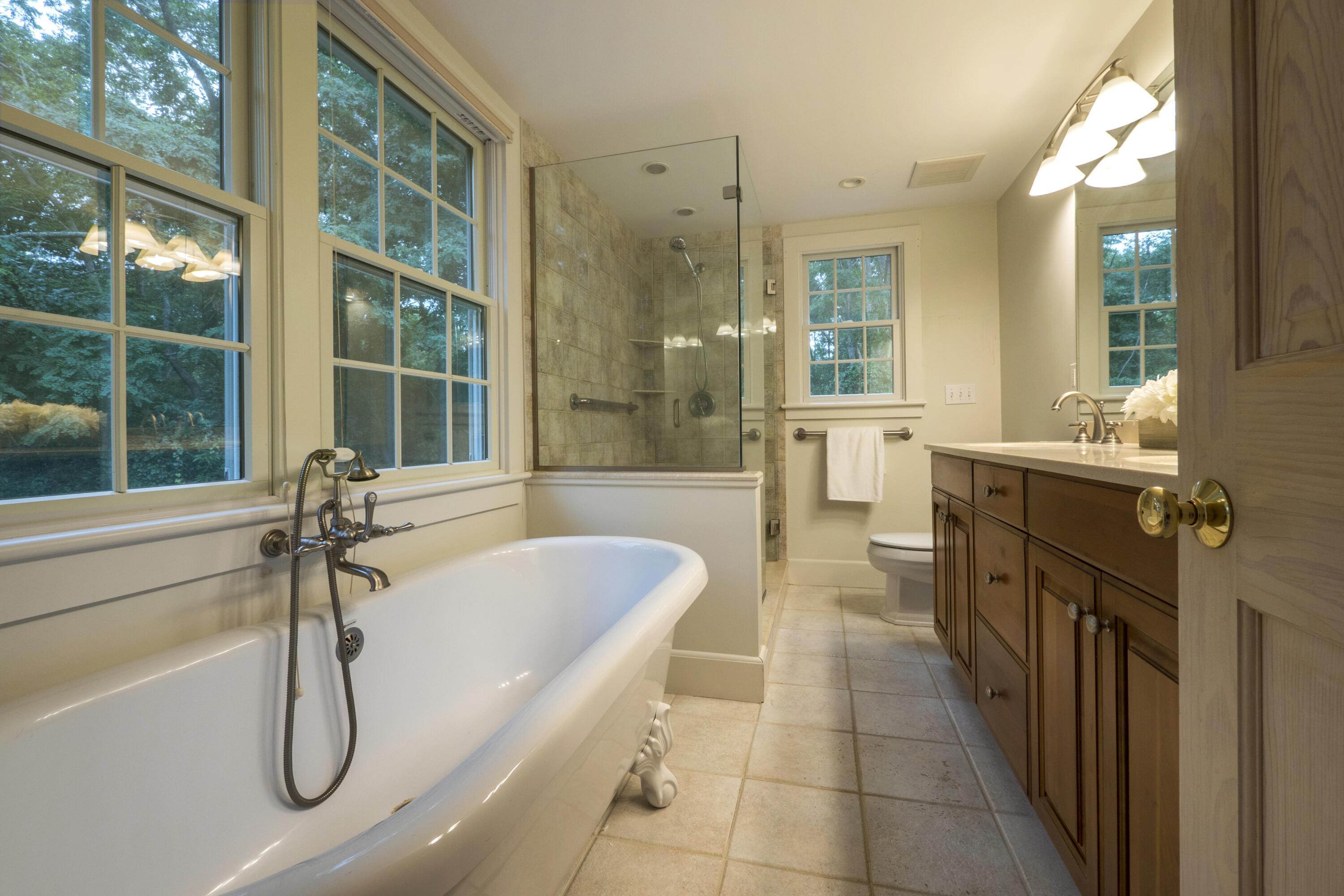 303 Maple Street West Barnstable, MA 02668 - Photo 7 of 19 a bathroom with a tub sink shower and mirror