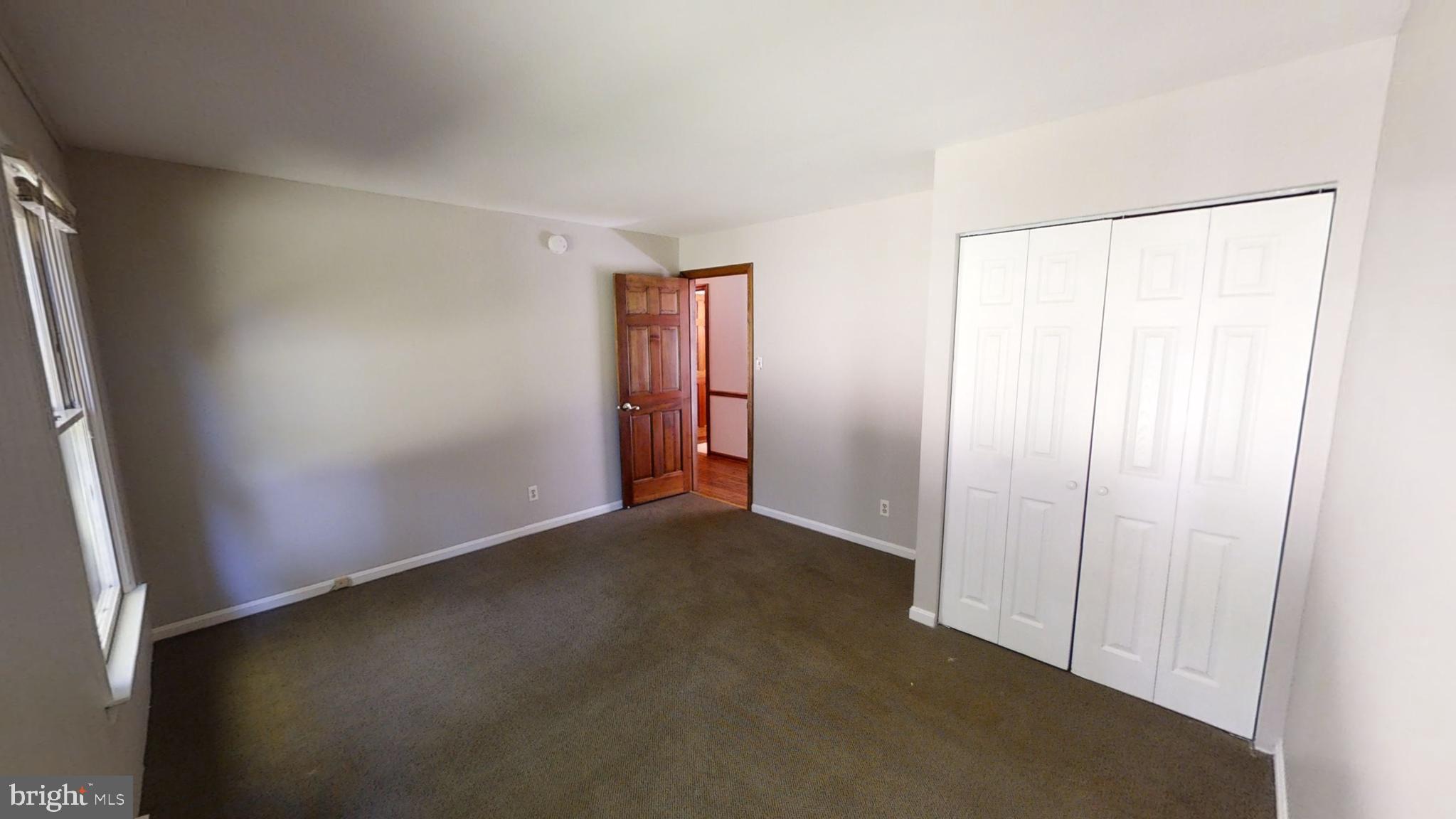 3842 Stoneybrook Road, Unit A White Plains, MD 20695 - Photo 13 of 33 an empty room with windows