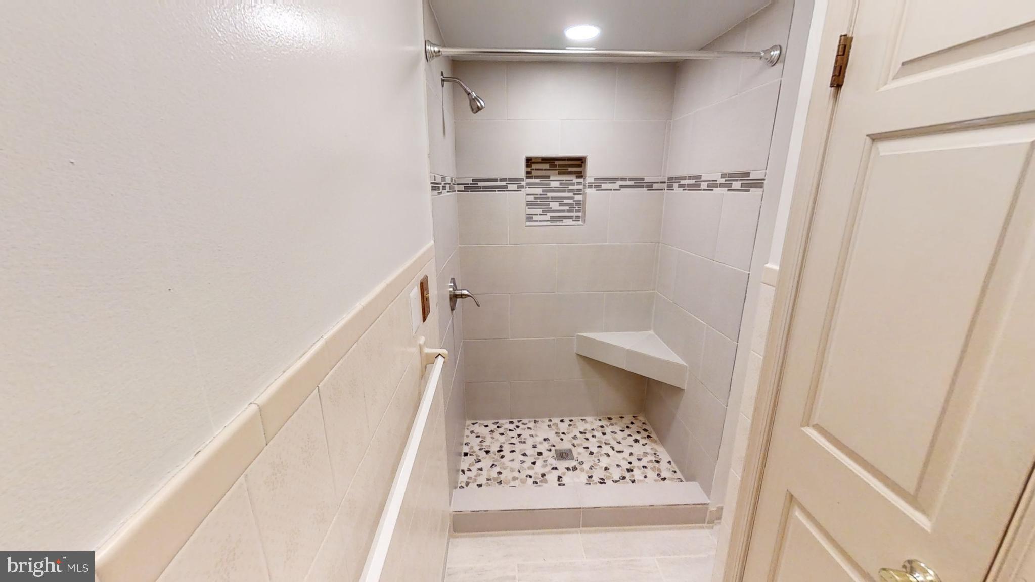 3842 Stoneybrook Road, Unit A White Plains, MD 20695 - Photo 16 of 33 a bathroom with a shower and a toilet