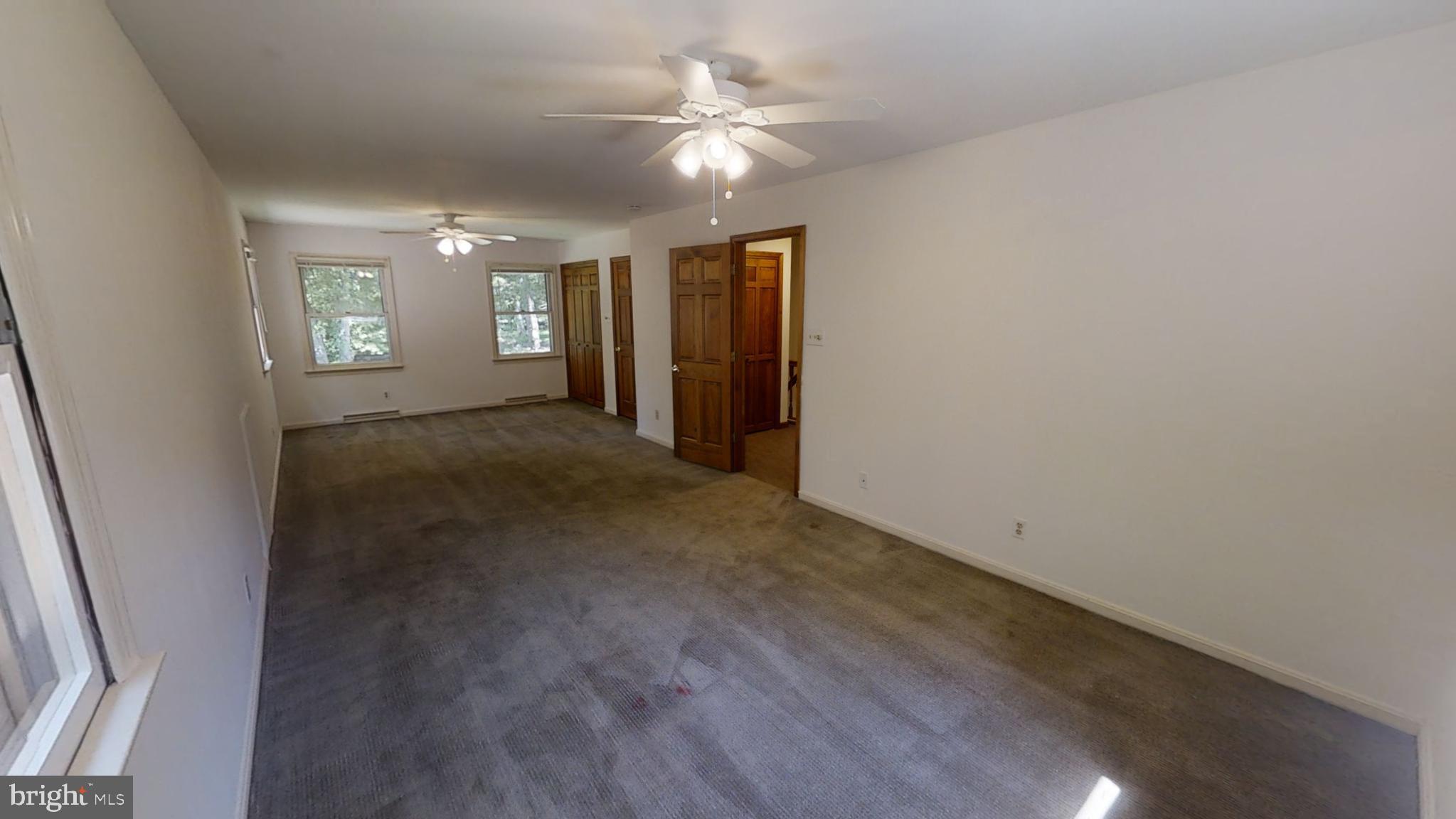 3842 Stoneybrook Road, Unit A White Plains, MD 20695 - Photo 18 of 33 an empty room with ceiling fan and window