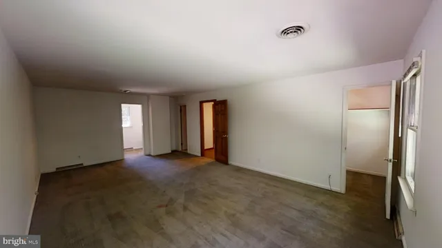 a bathroom with a sink a mirror and a window