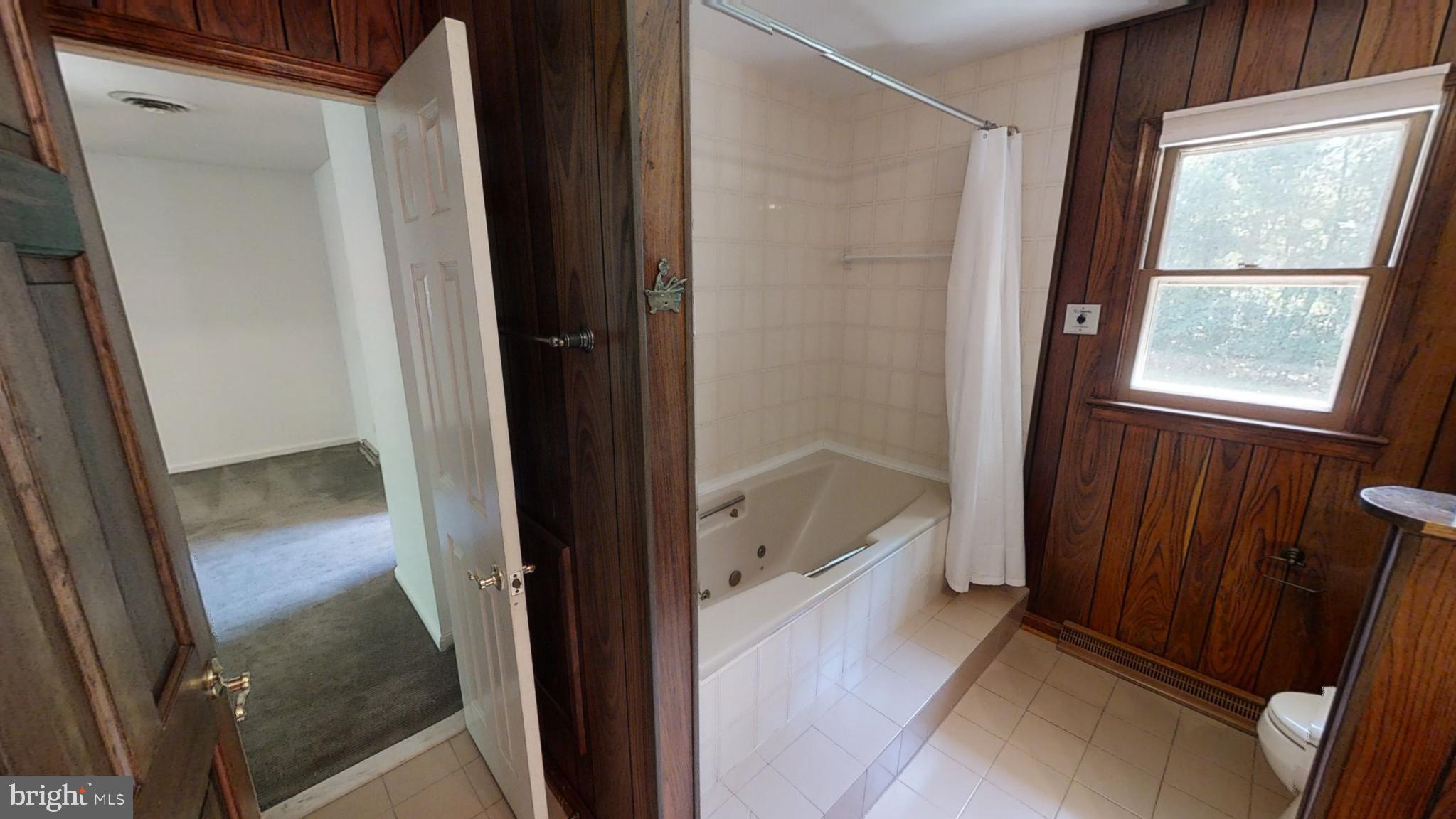 3842 Stoneybrook Road, Unit A White Plains, MD 20695 - Photo 22 of 33 a bathroom with a tub