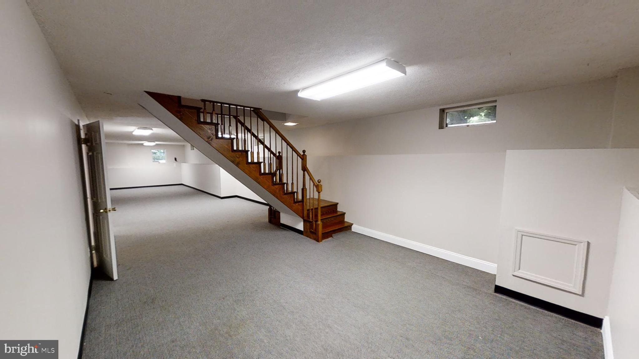 3842 Stoneybrook Road, Unit A White Plains, MD 20695 - Photo 24 of 33 a view of an empty room with stairs