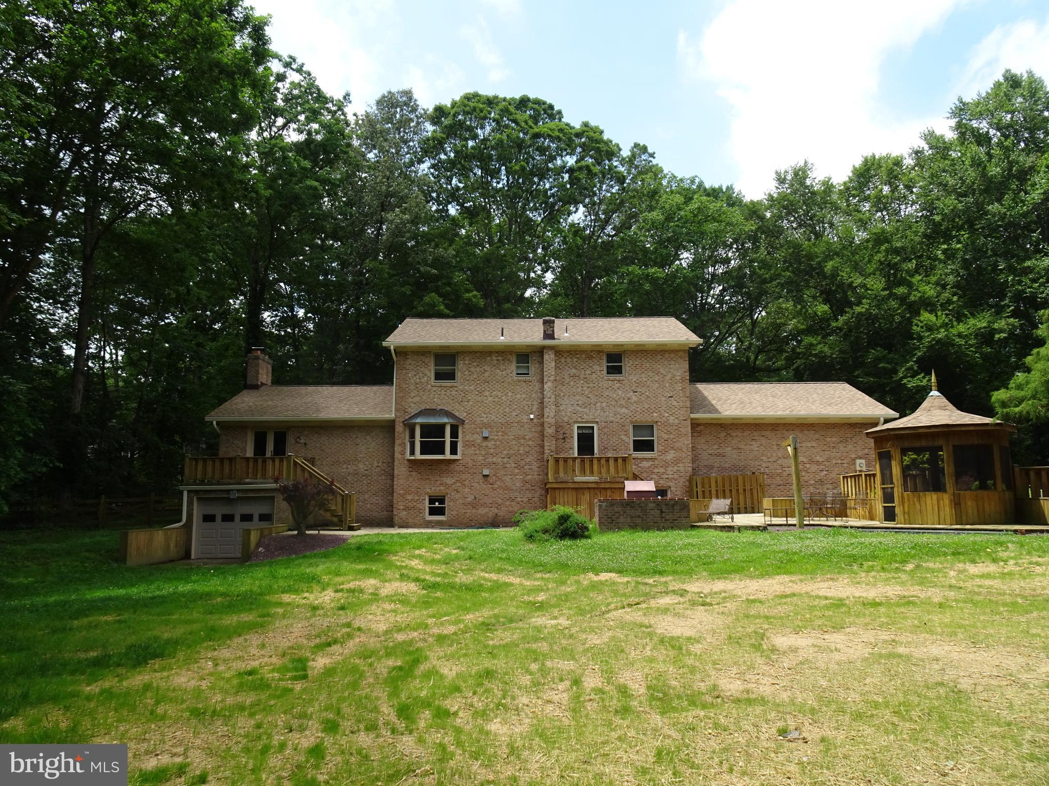 3842 Stoneybrook Road, Unit A White Plains, MD 20695 - Photo 30 of 33 a aerial view of a house with a yard and sitting area