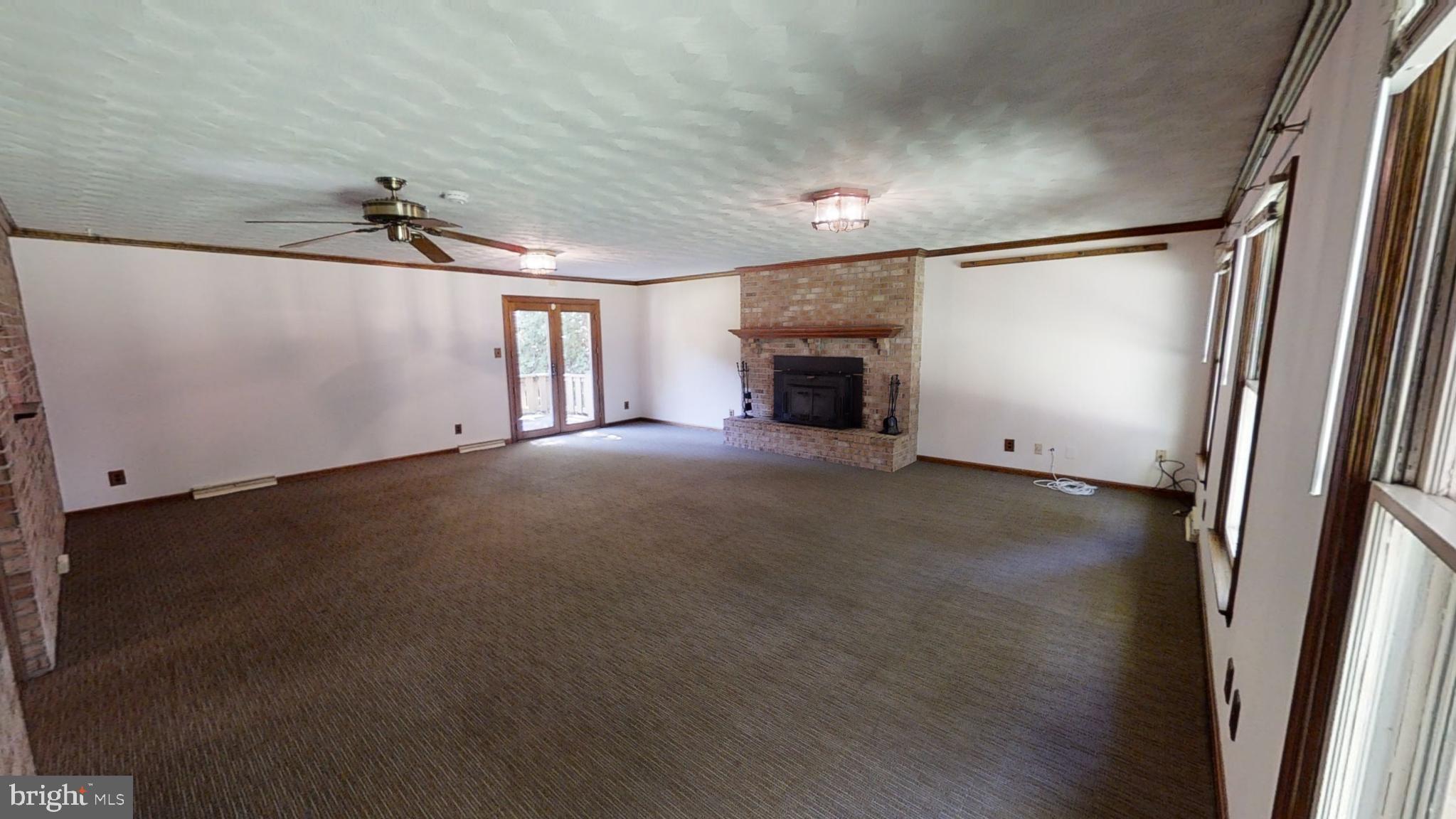 3842 Stoneybrook Road, Unit A White Plains, MD 20695 - Photo 6 of 33 an empty room with windows