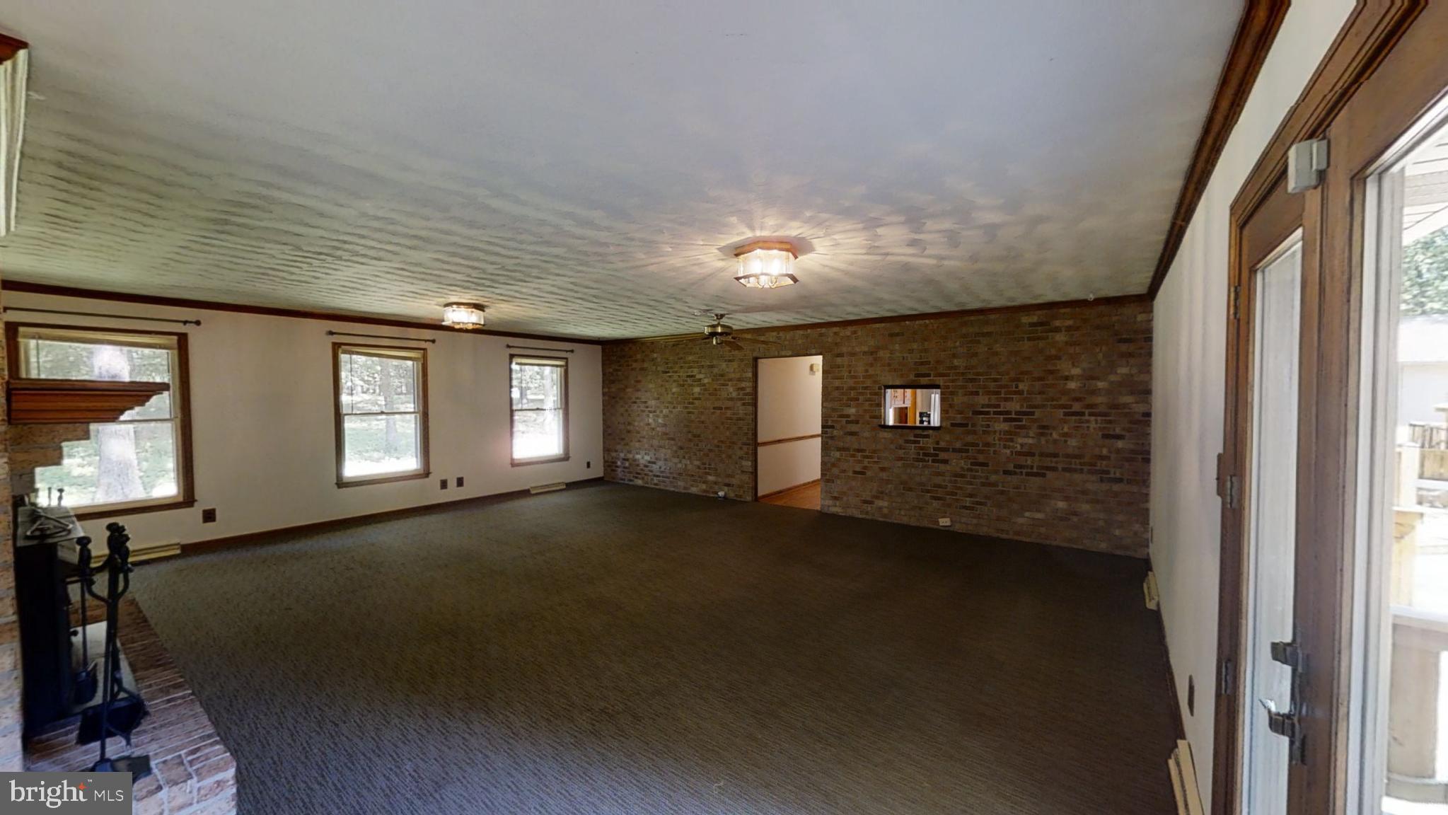 3842 Stoneybrook Road, Unit A White Plains, MD 20695 - Photo 9 of 33 a view of a livingroom with an empty space and a window