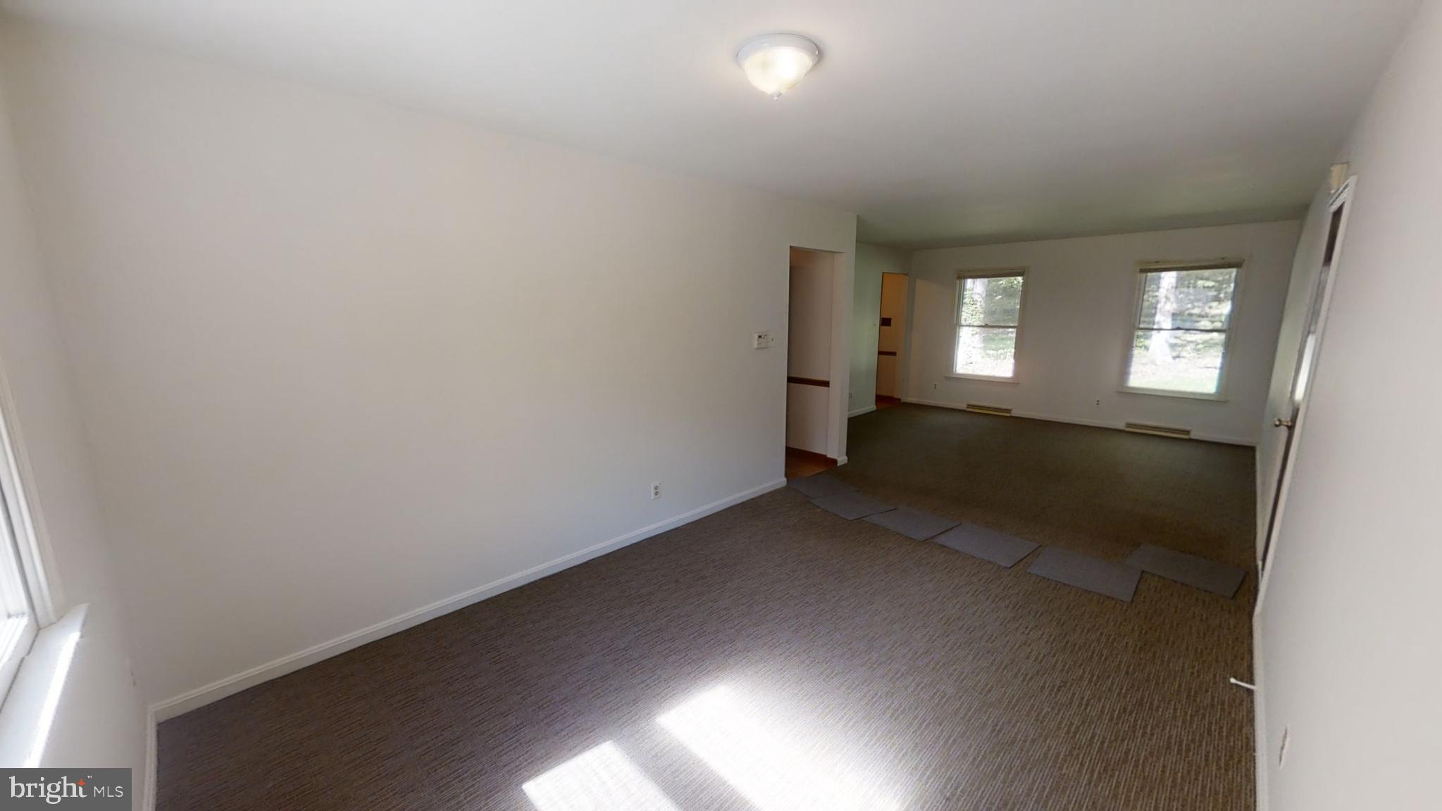 3842 Stoneybrook Road, Unit A White Plains, MD 20695 - Photo 10 of 33 an empty room with windows