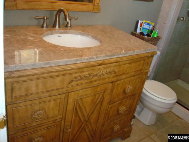 84 Zircon Drive Reno, NV 89521 - Photo 8 of 9 a bathroom with a sink and a toilet