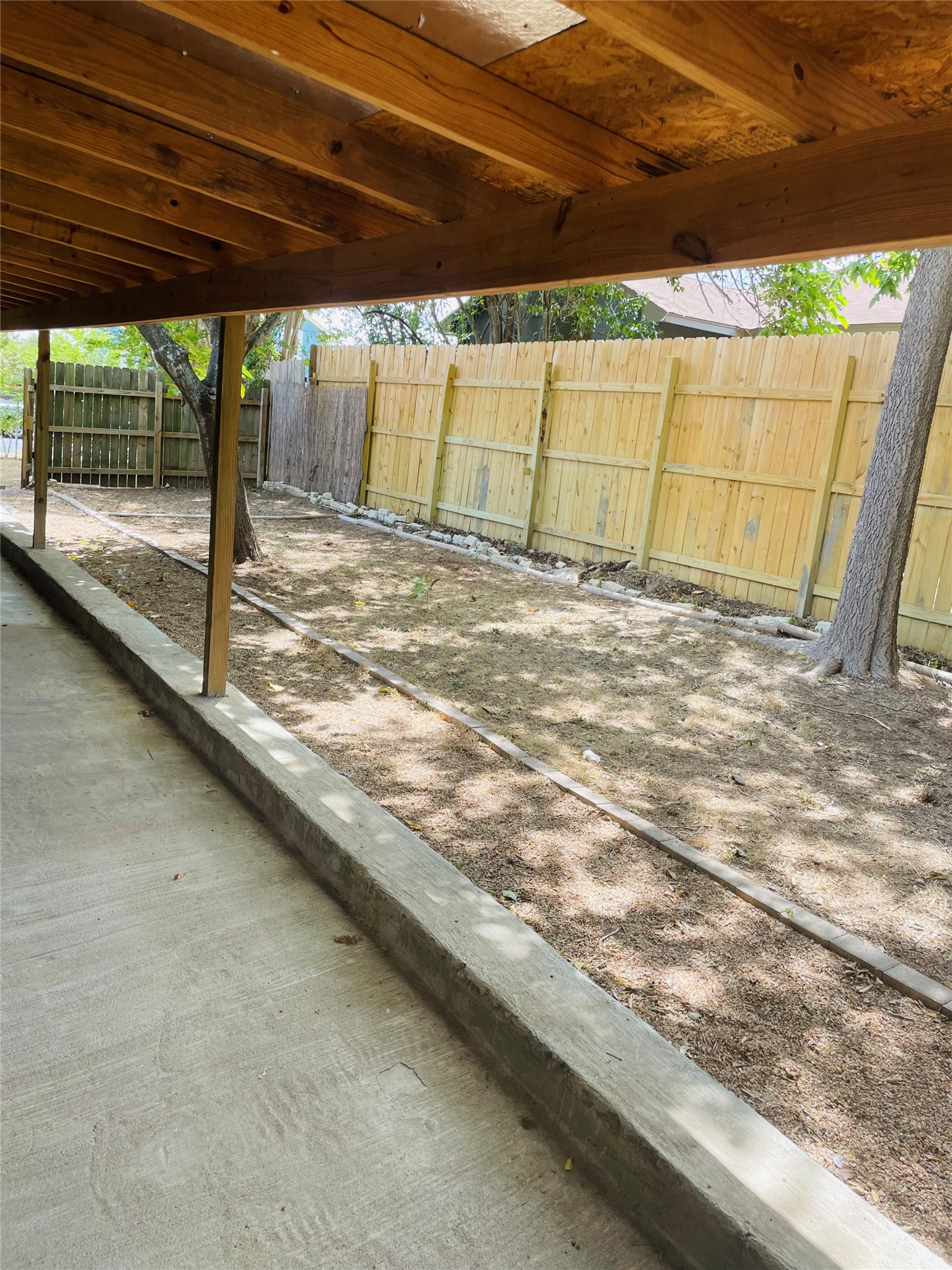 2406 Patsy Parkway Austin, TX 78744 - Photo 7 of 9 Fenced backyard featuring a patio area