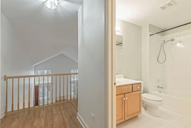a bathroom with a toilet a sink and shower