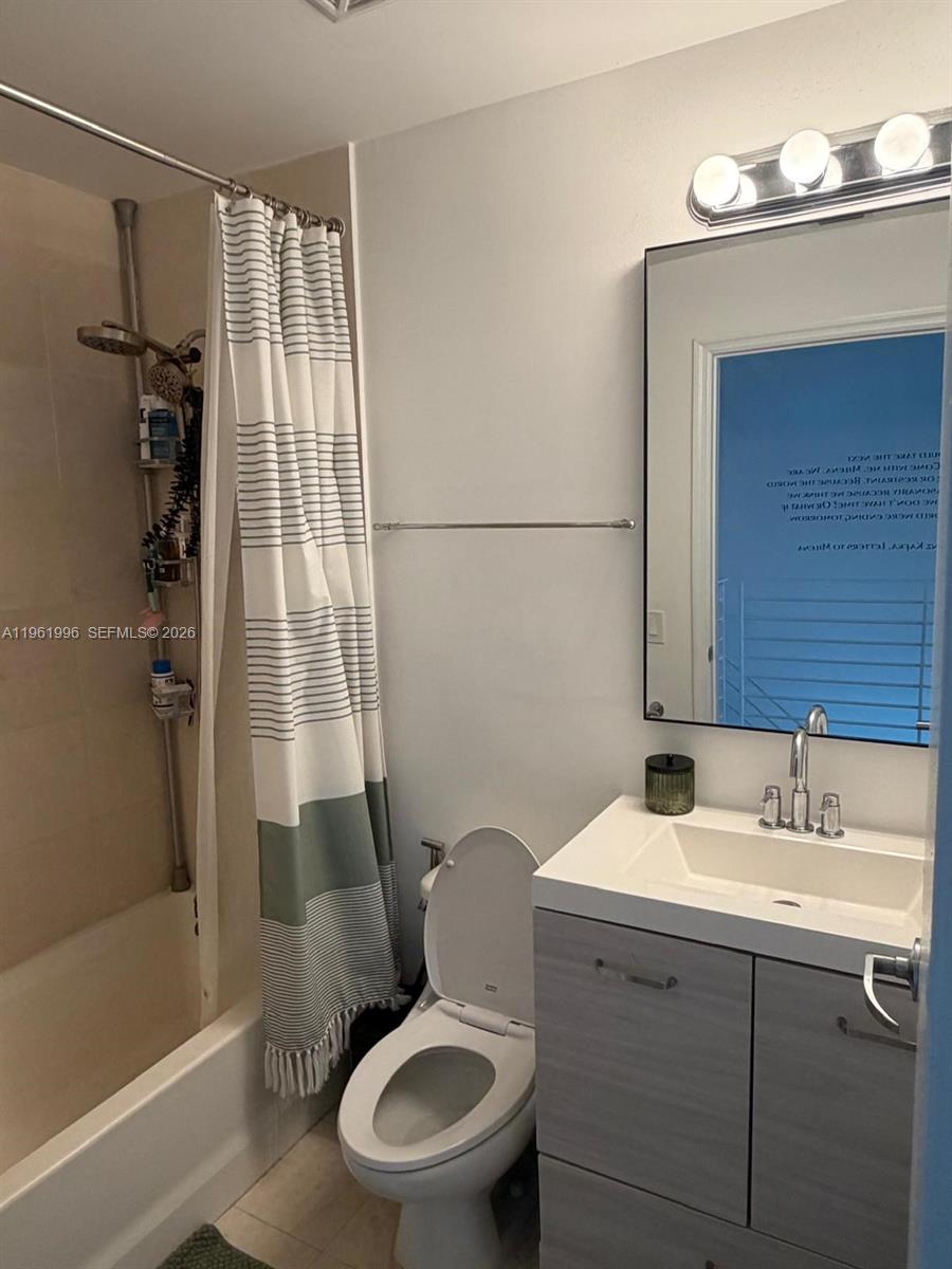 60 Southwest 13th Street, Unit 1107 Miami, FL 33130 - Photo 19 of 47 a bathroom with a sink toilet and shower