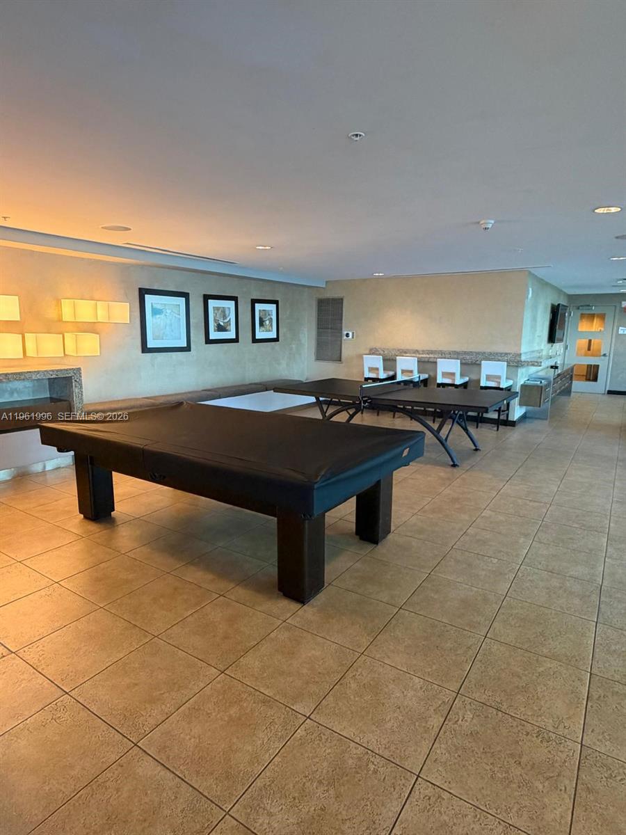 60 Southwest 13th Street, Unit 1107 Miami, FL 33130 - Photo 29 of 47 a room with pool table and windows