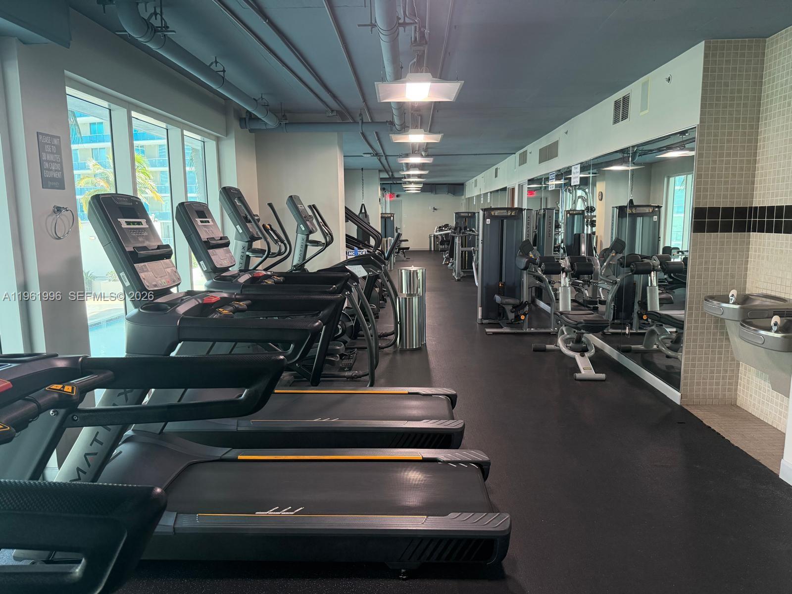 60 Southwest 13th Street, Unit 1107 Miami, FL 33130 - Photo 36 of 47 a view of a room with gym equipment