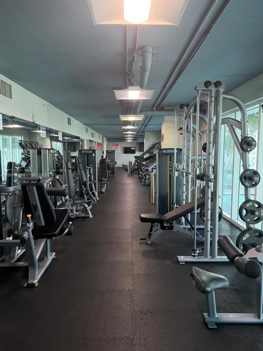60 Southwest 13th Street, Unit 1107 Miami, FL 33130 - Photo 45 of 47 a view of a room with gym equipment
