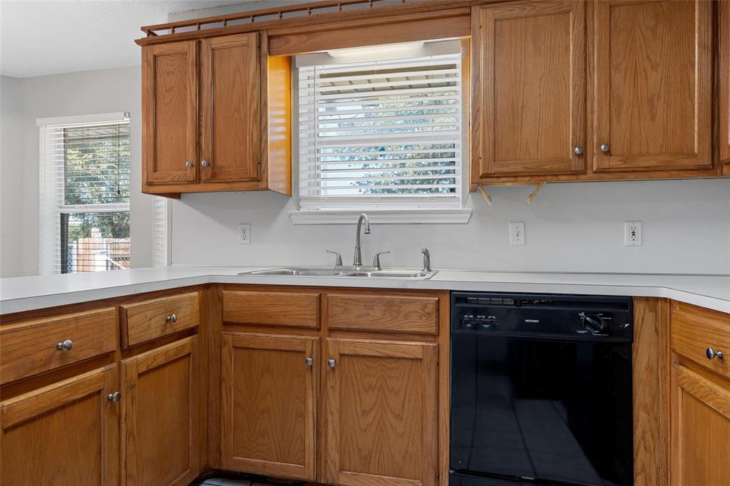 4609 Lexington Street Waco, TX 76705 - Photo 15 of 25 a kitchen with stainless steel appliances granite countertop cabinets and a sink