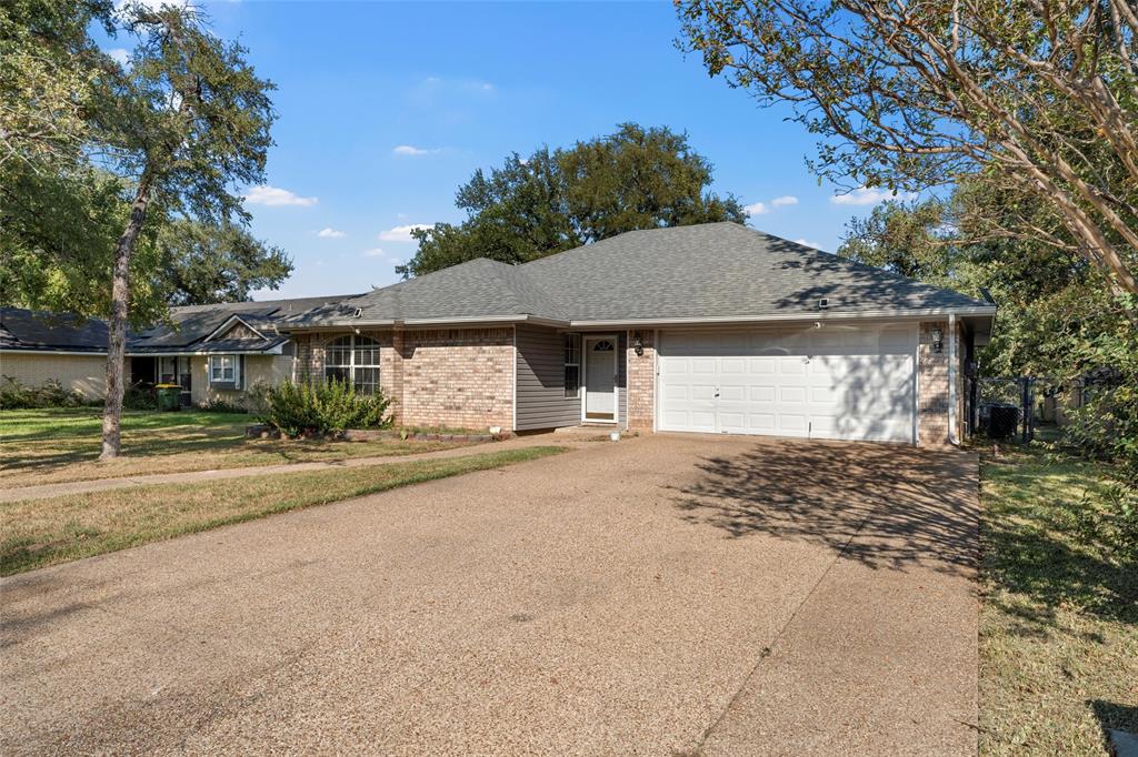 4609 Lexington Street Waco, TX 76705 - Photo 4 of 25 a view of a house with a yard and garage
