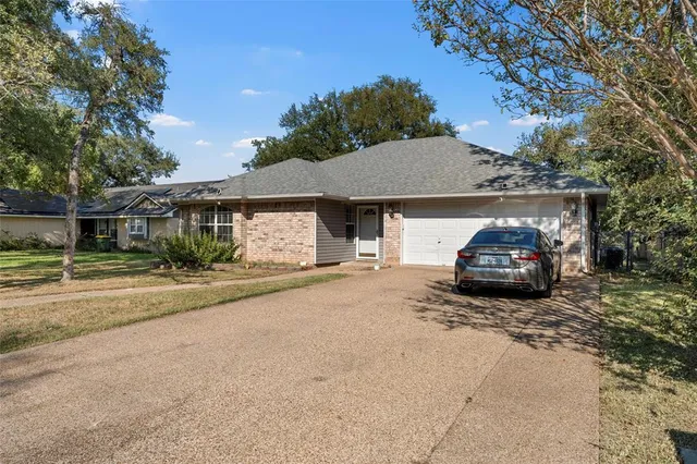 a car parked in front of a house