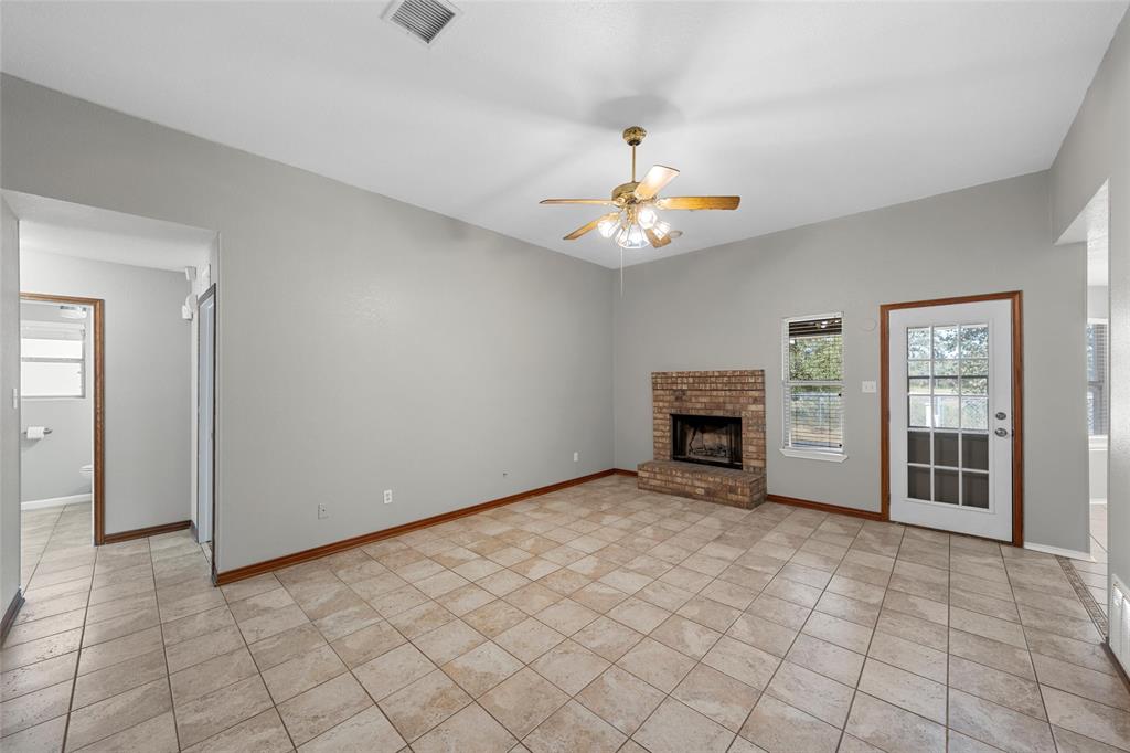 4609 Lexington Street Waco, TX 76705 - Photo 7 of 25 a view of an empty room with a fireplace