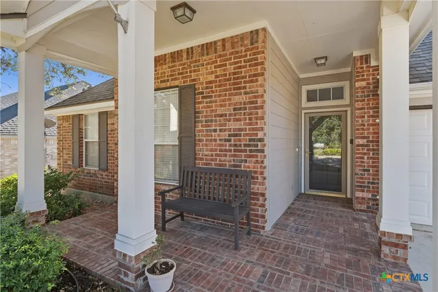 a front view of a house with a glass door