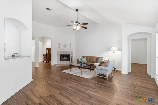 a living room with furniture and a fireplace