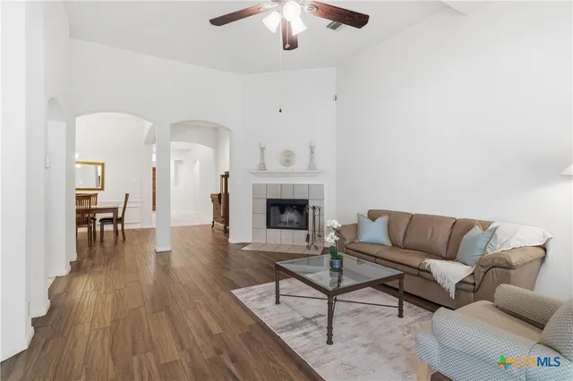 a living room with furniture and a fireplace
