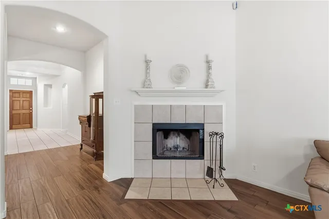 a living room with a fireplace and a fireplace