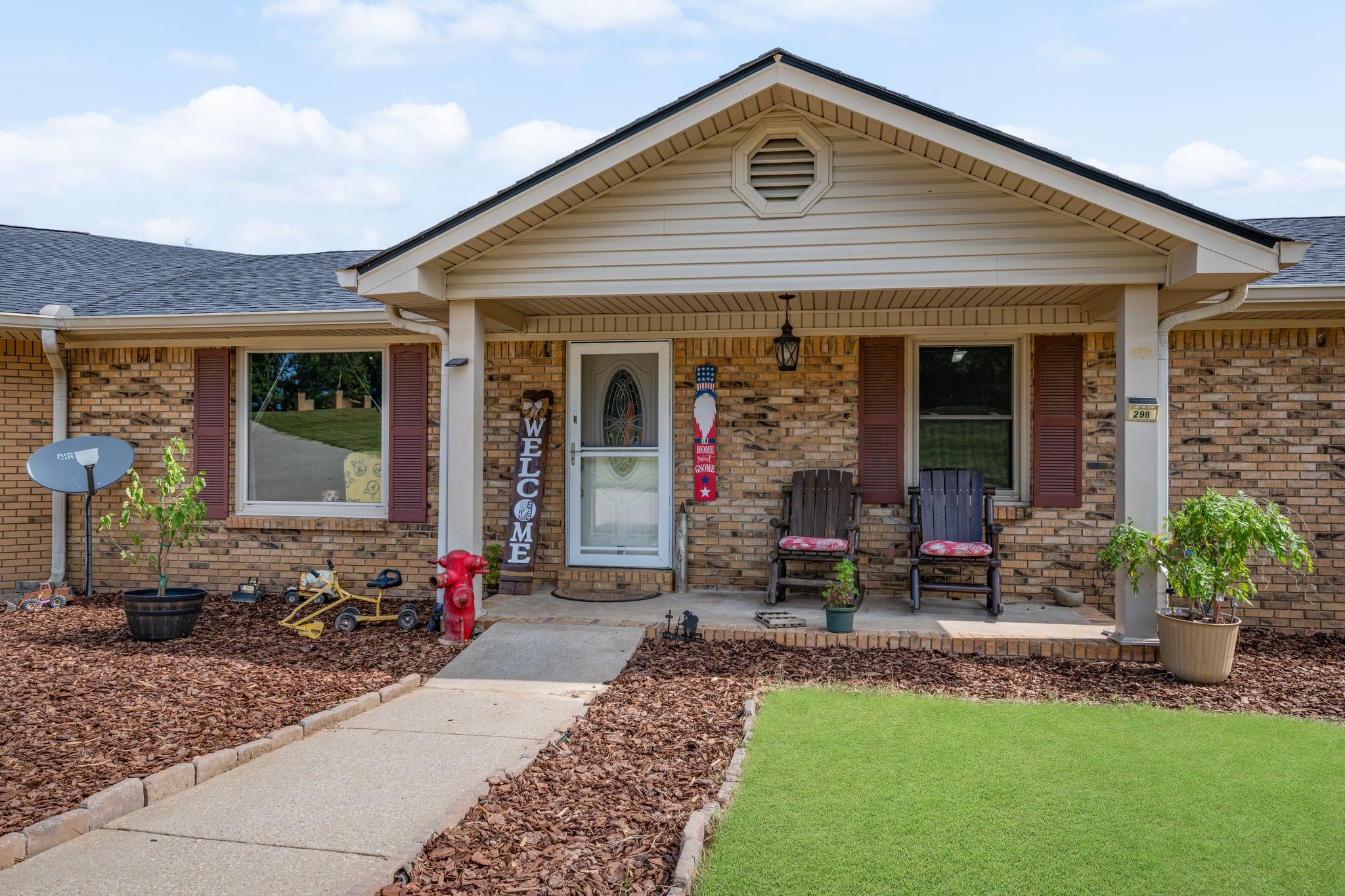 298 Langford Road Waverly, TN 37185 - Photo 3 of 53 a front view of a house with sitting area