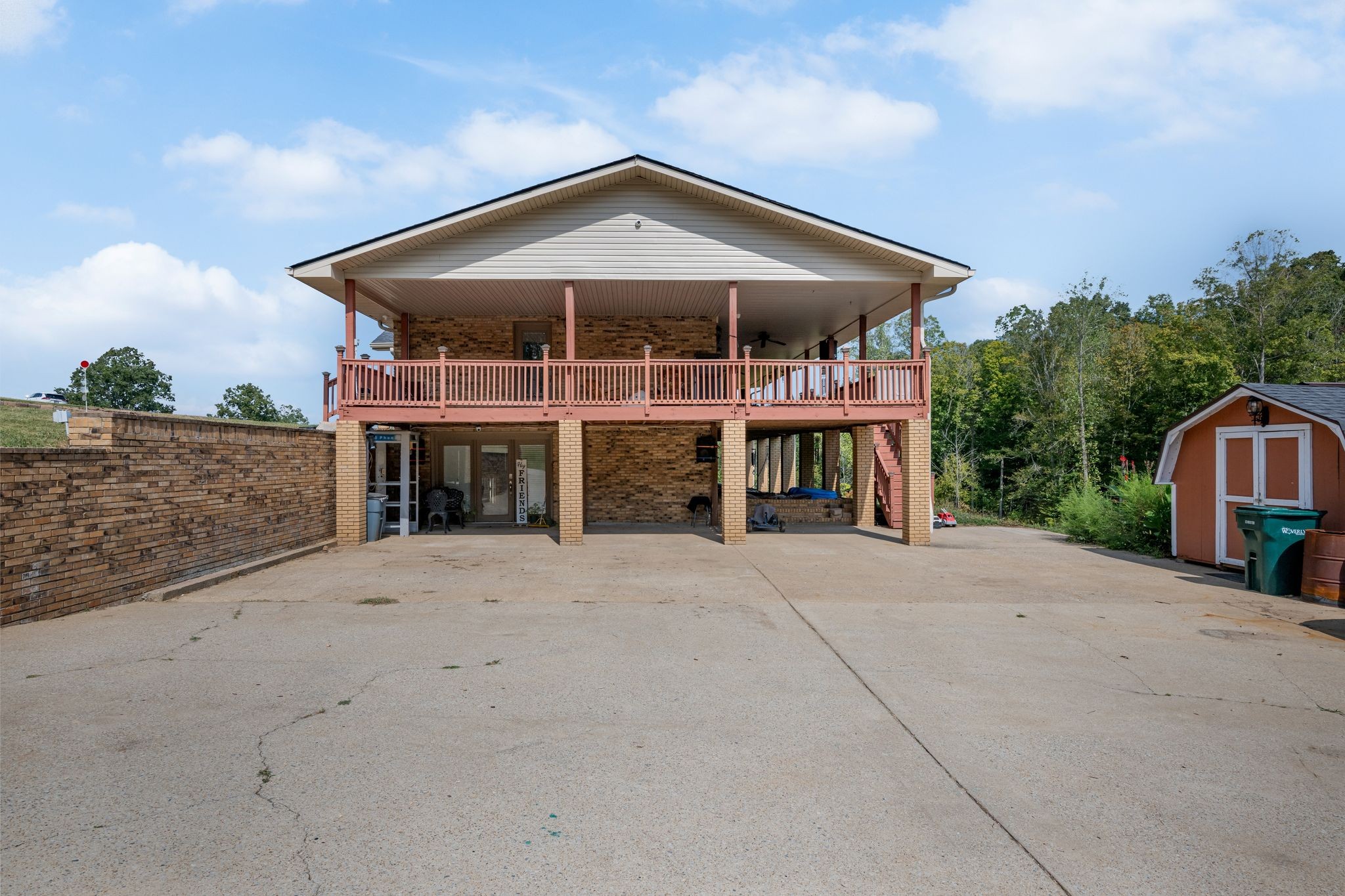 298 Langford Road Waverly, TN 37185 - Photo 37 of 53 a front view of a house with a yard and balcony