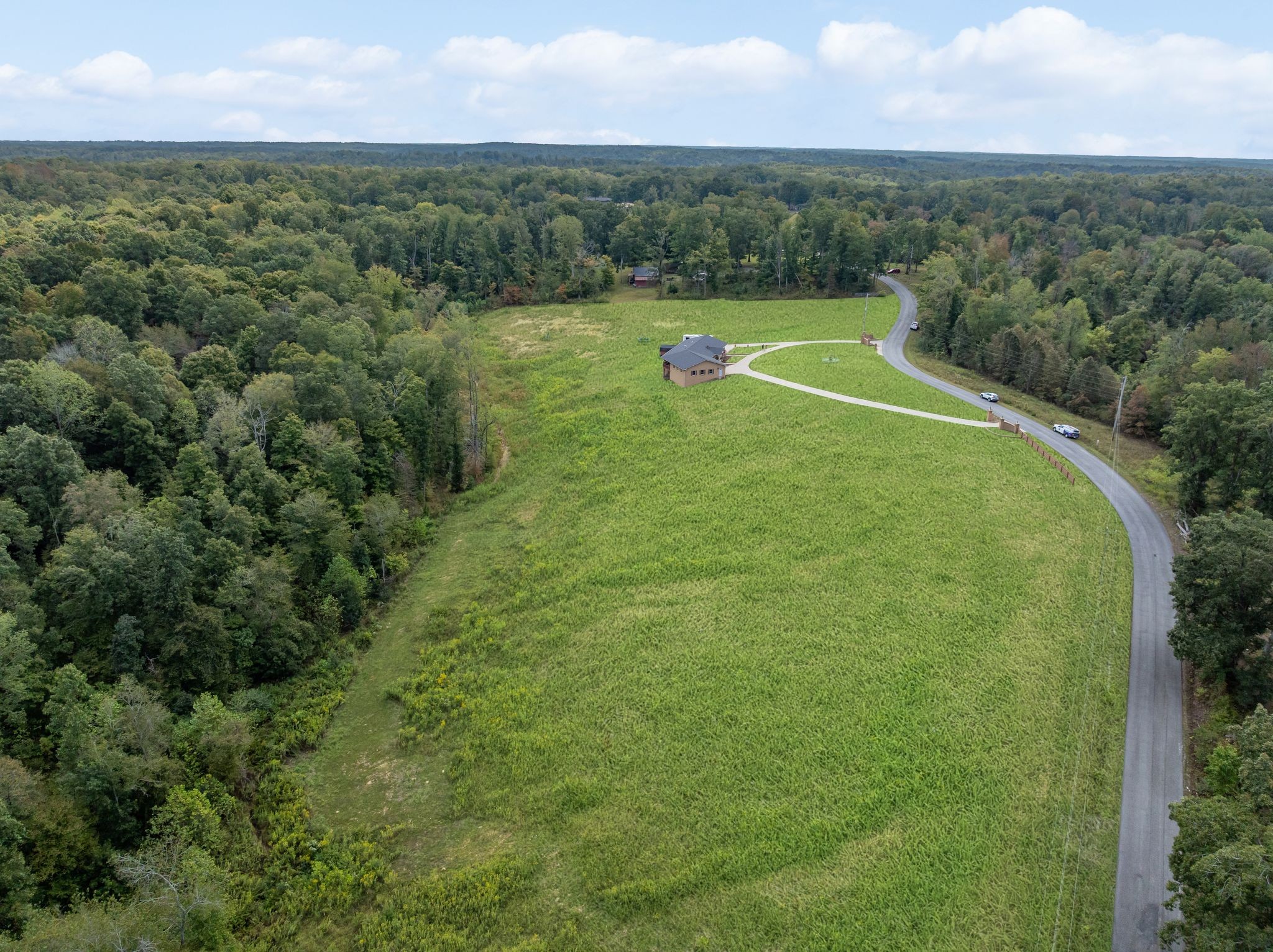 298 Langford Road Waverly, TN 37185 - Photo 43 of 53 a view of a green yard with a lake