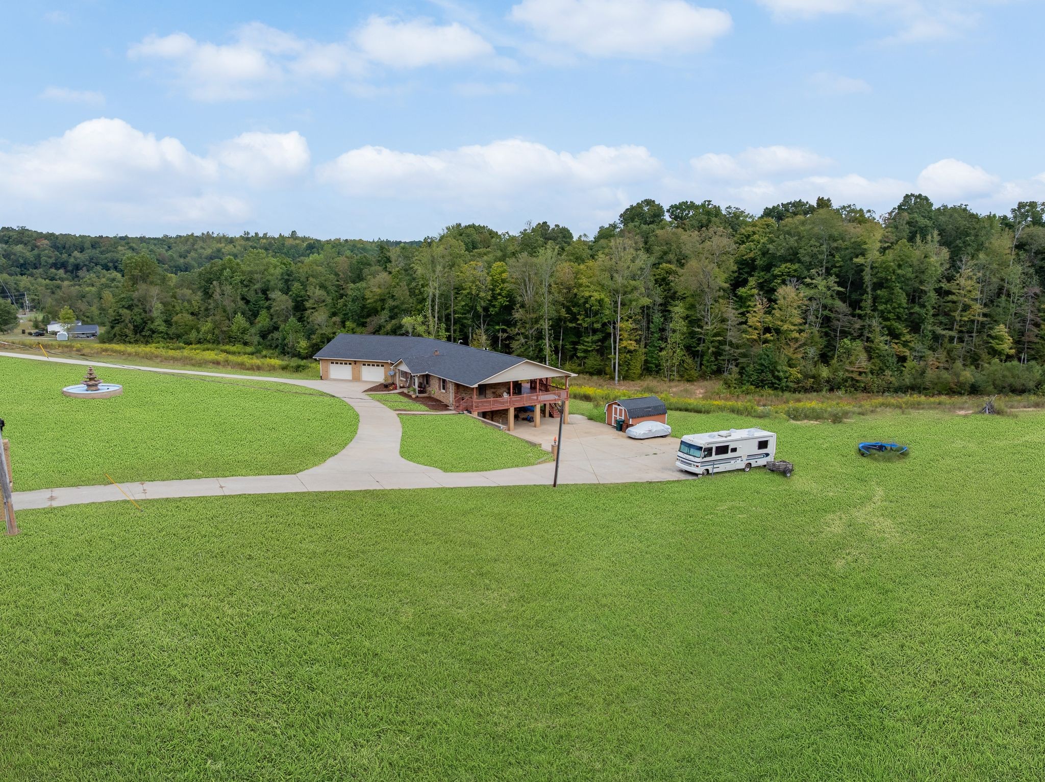 298 Langford Road Waverly, TN 37185 - Photo 45 of 53 a view of a playground with swimming pool and deck