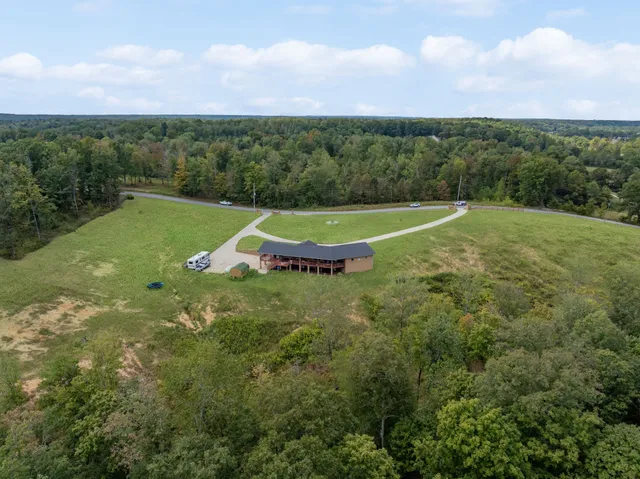 a view of a green filed with a yard