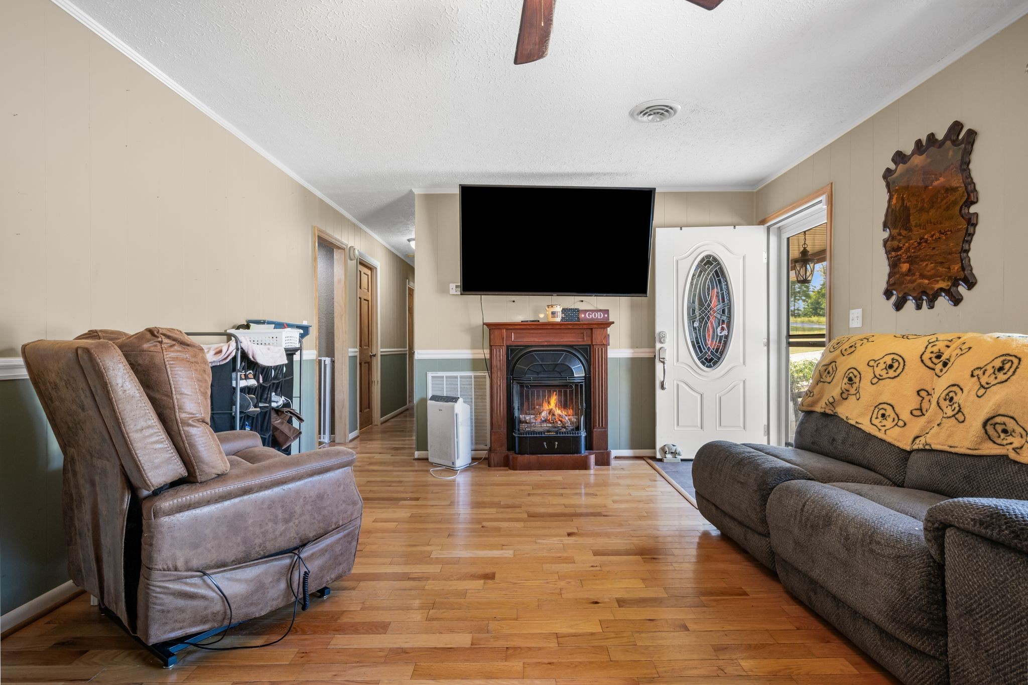 298 Langford Road Waverly, TN 37185 - Photo 5 of 53 a living room with furniture a flat screen tv and a fireplace