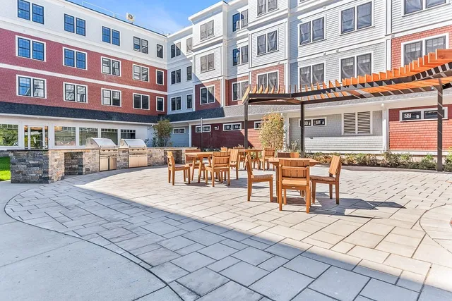 a building view with outdoor seating