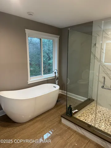 a bath tub sitting next to a window
