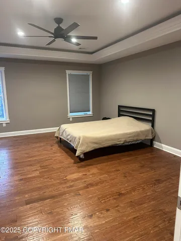 a bedroom with bed and window