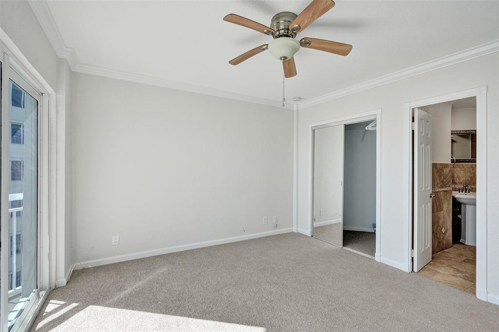 710 North Ocean Boulevard, Unit 910 Pompano Beach, FL 33062 - Photo 16 of 65 an empty room with closet and a ceiling fan