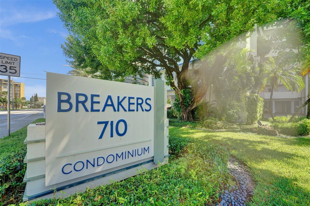 710 North Ocean Boulevard, Unit 910 Pompano Beach, FL 33062 - Photo 30 of 65 a sign broad on the side of the road