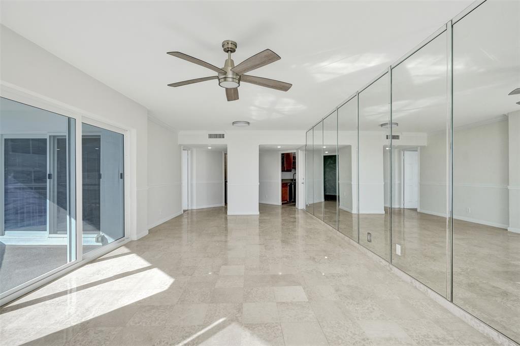 710 North Ocean Boulevard, Unit 910 Pompano Beach, FL 33062 - Photo 5 of 65 a view of a livingroom with a ceiling fan & entryway