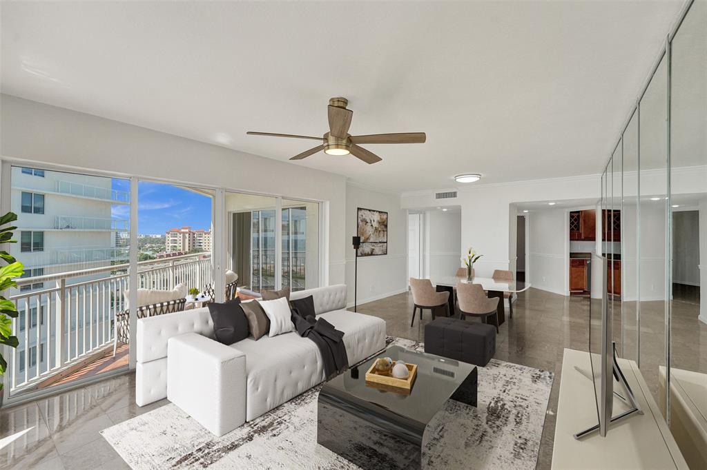 710 North Ocean Boulevard, Unit 910 Pompano Beach, FL 33062 - Photo 6 of 65 a living room with furniture a ceiling fan and a window