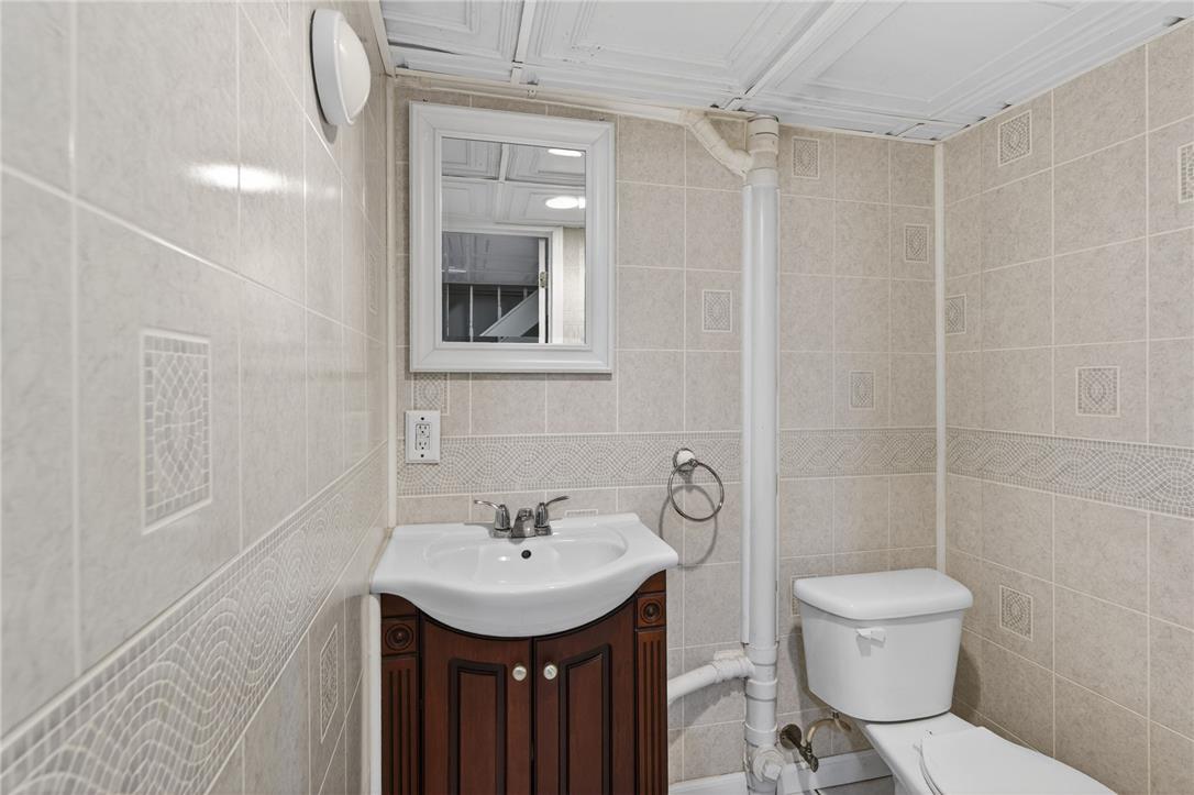 1371 Stoke Park Road Bethlehem, PA 18017 - Photo 51 of 55 a bathroom with a sink a toilet and shower