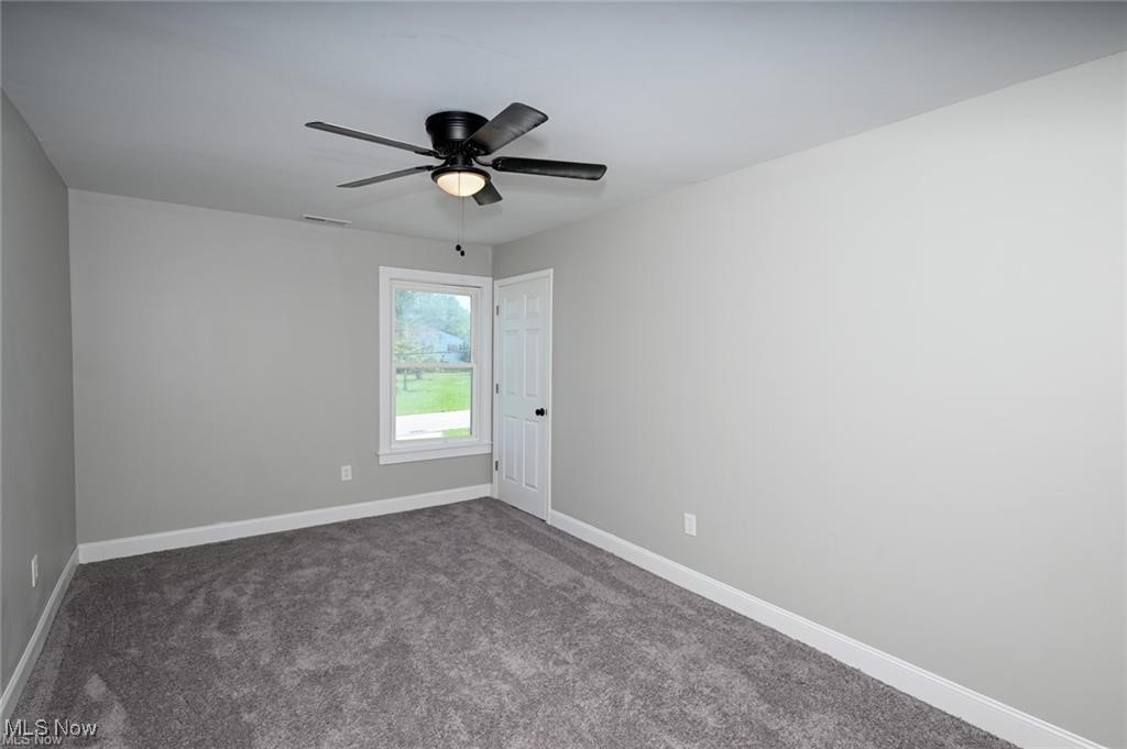 7613 Jefferson Road Ashtabula, OH 44004 - Photo 22 of 35 Carpeted spare room featuring ceiling fan