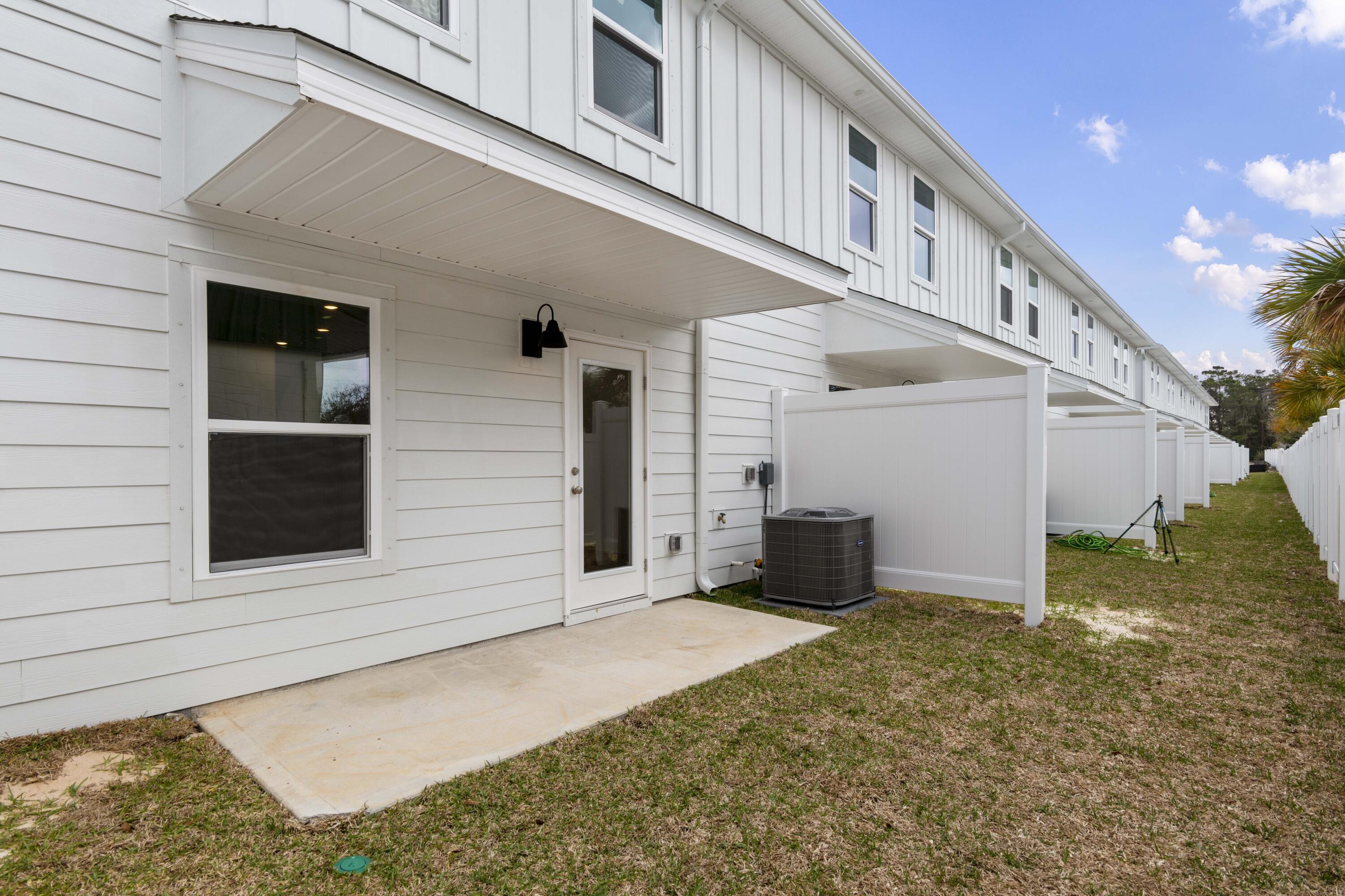 18 Redbird Loop Destin, FL 32541 - Photo 20 of 21 a view of a house with a yard