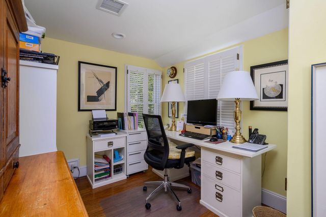 a spacious bathroom with a tub a sink and a window